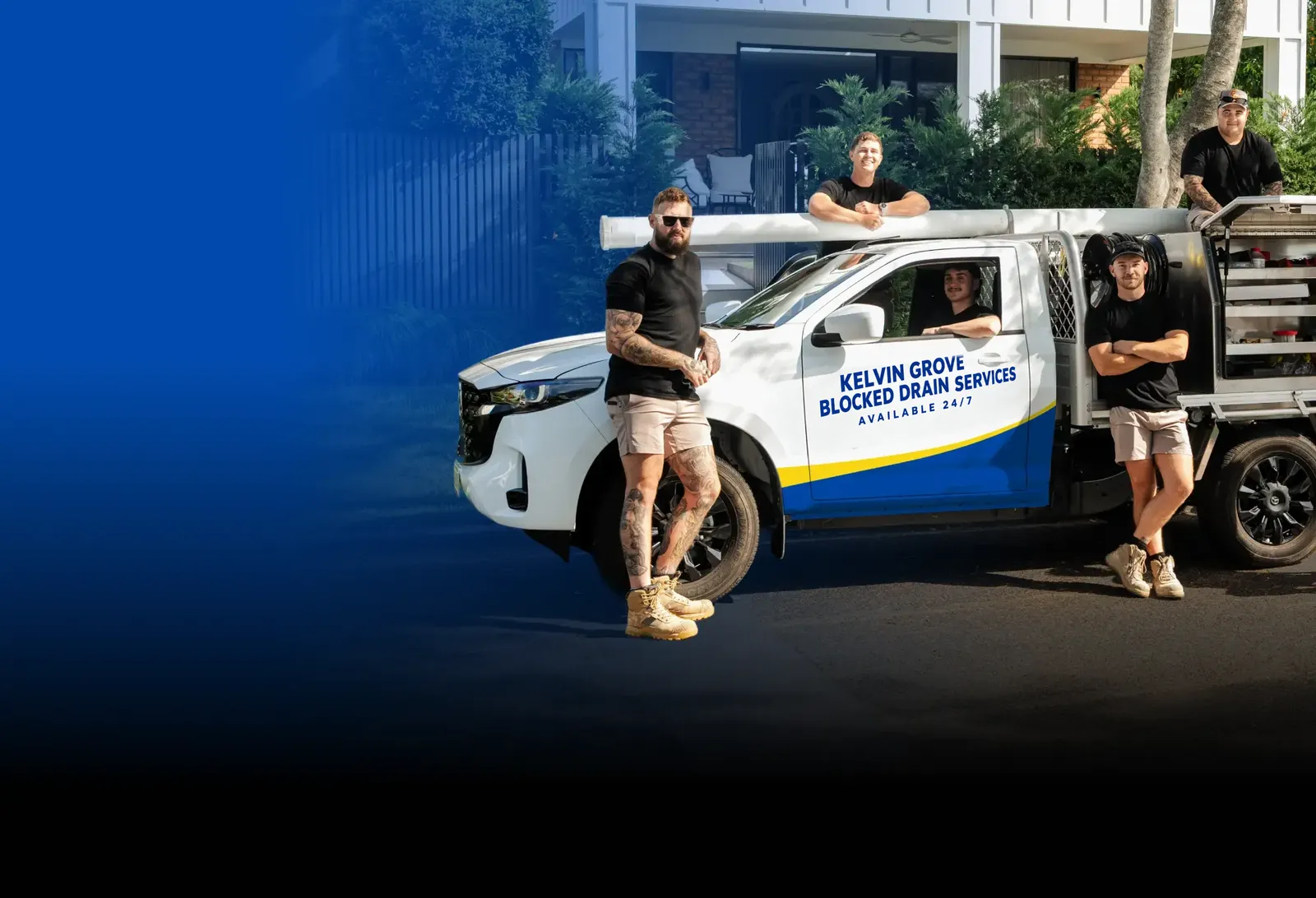 Kelvin Grove Blocked Drain Services team with the ute